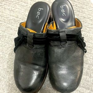 Born Concept black clogs with tassel
